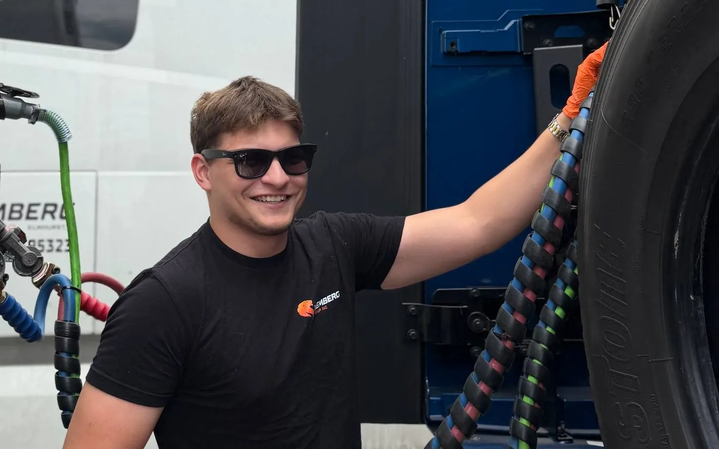 Driver connecting the air lines during a pre-trip inspection