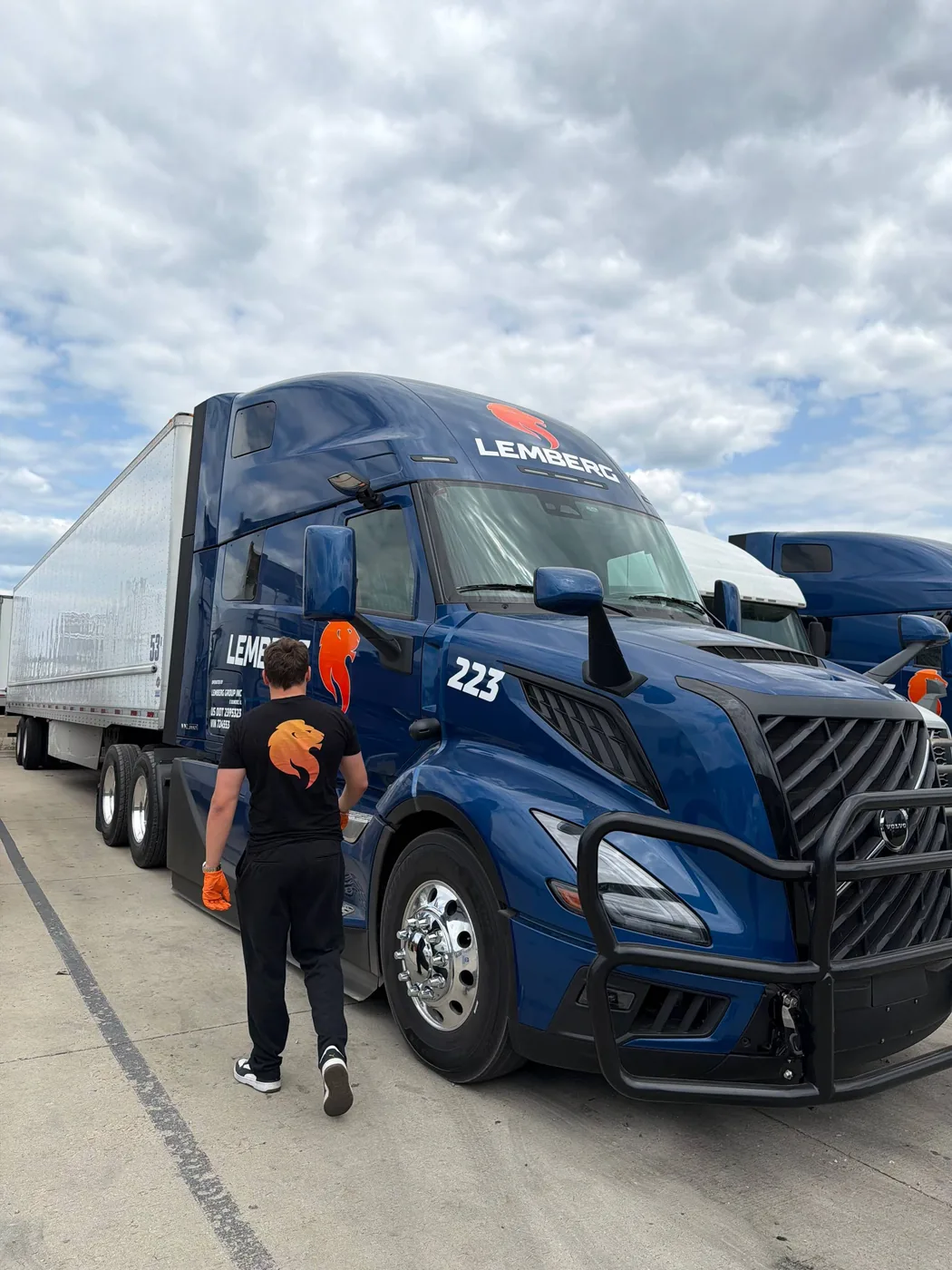 Driver walking up to a loaded 53-foot dry van